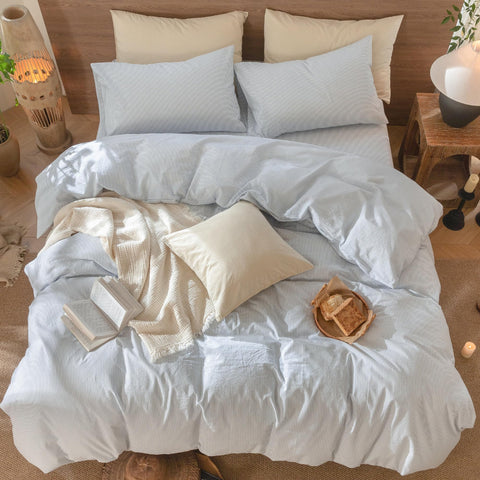 Bedroom ambience with MooMee cornflower blue stripes enhancing calm decor.