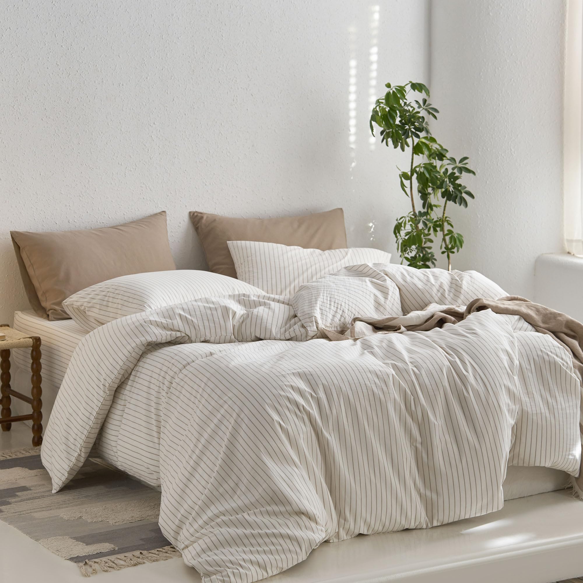 MooMee bedroom style with white tannish stripes enhances a calm, stylish sleep space.