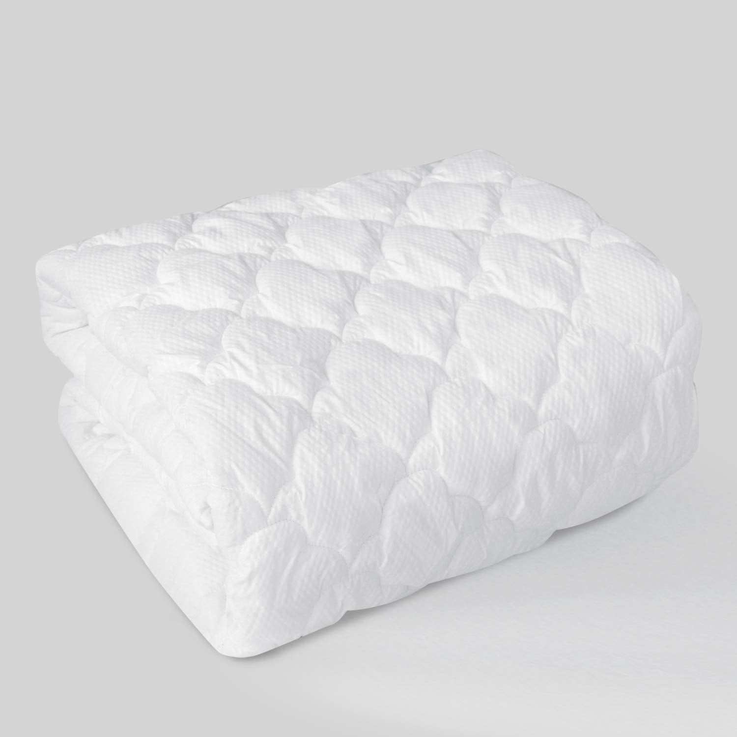 Moonsea queen air mattress pad topper in use on a bed