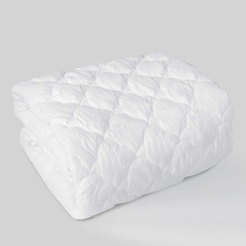 Moonsea queen air mattress pad topper in use on a bed