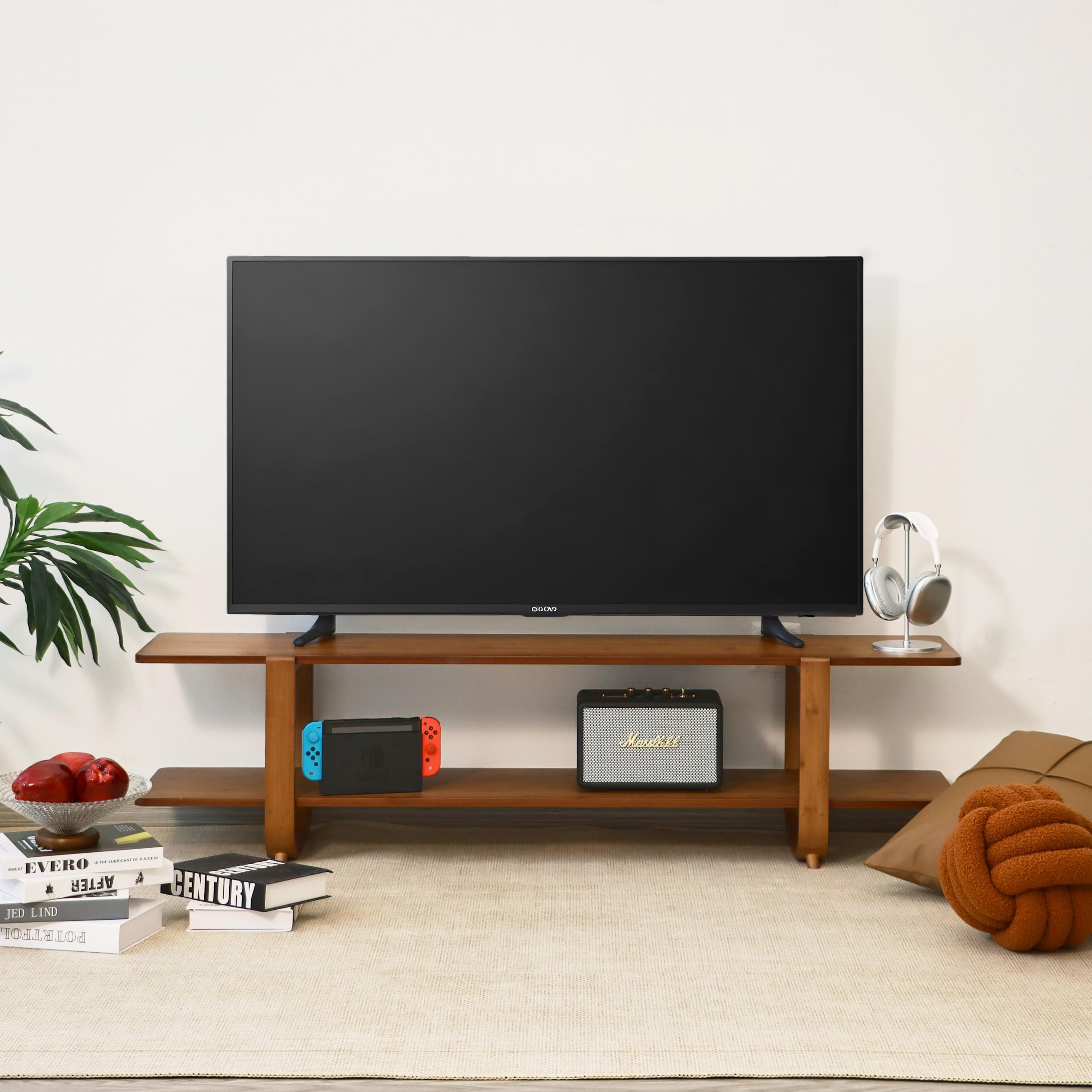 Mordchil HF bamboo TV stand used as a coffee table or console surface in a living area.