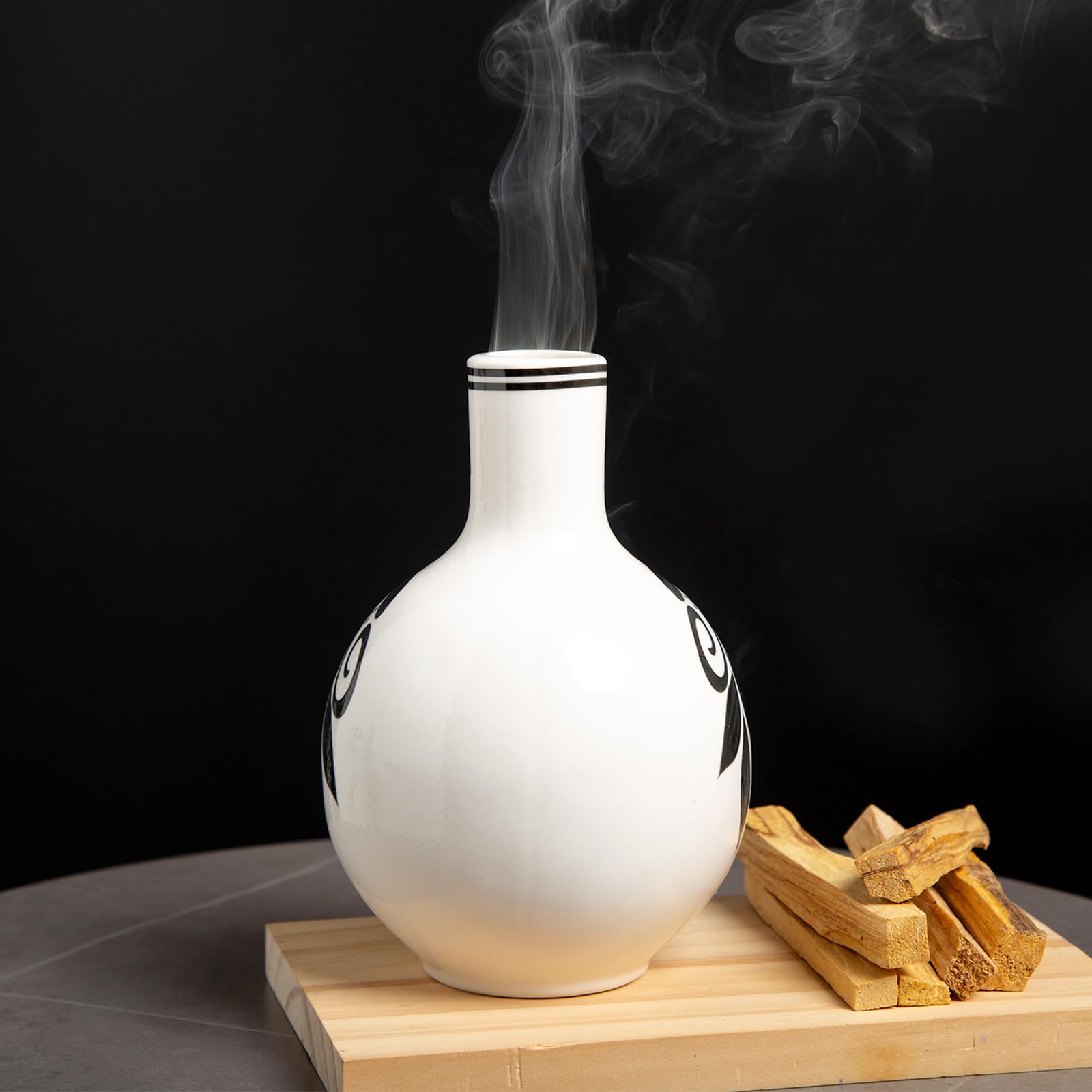 MOUGIGI Palo Santo burner on tabletop creates calming aromatherapy ambiance.