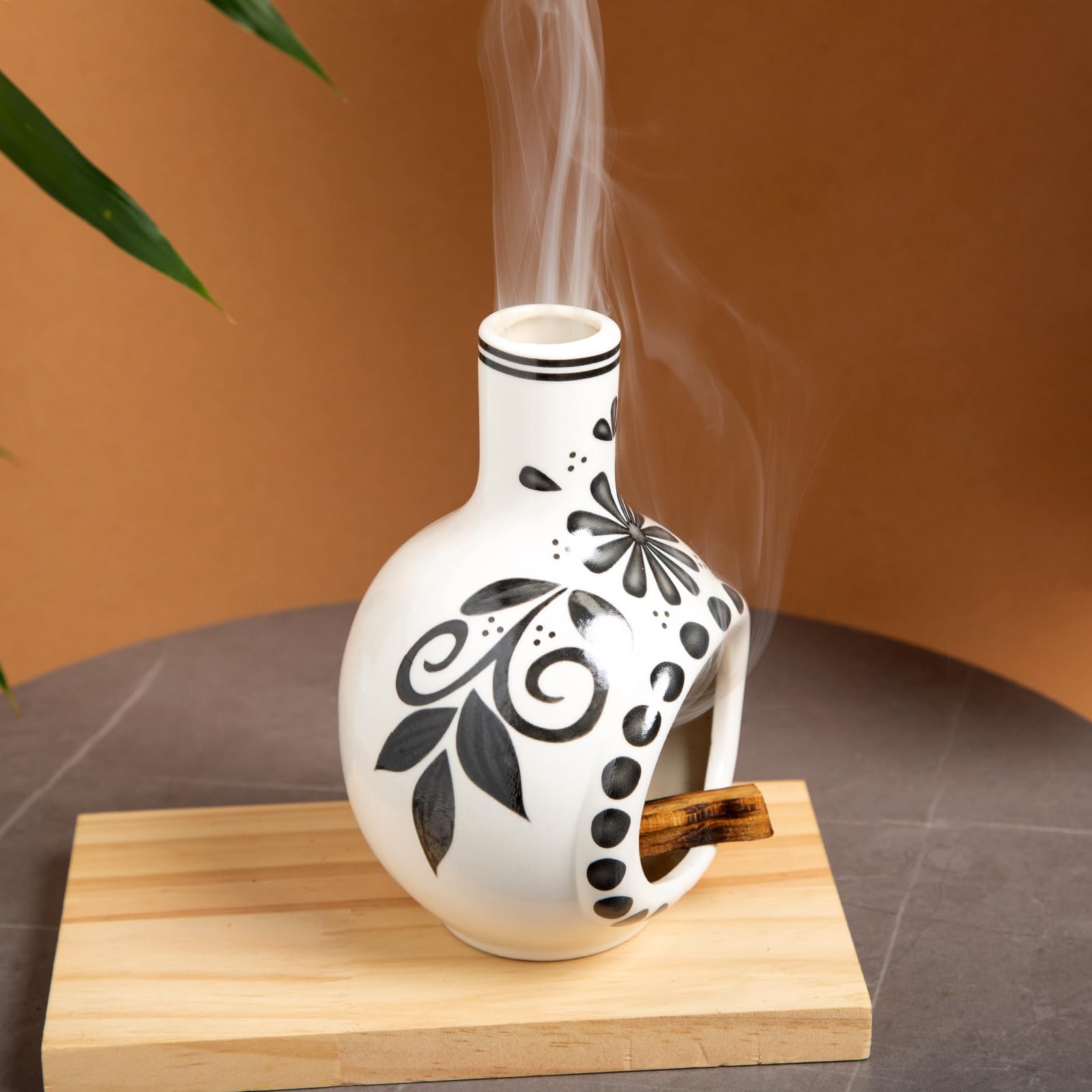MOUGIGI Palo Santo holder supports cone incense for versatile use.