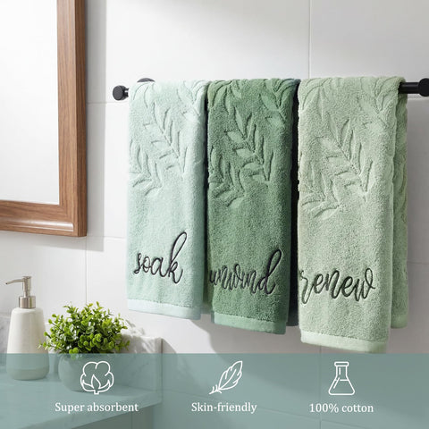 Leaf-patterned jacquard towels brighten decor while drying hands after washing.