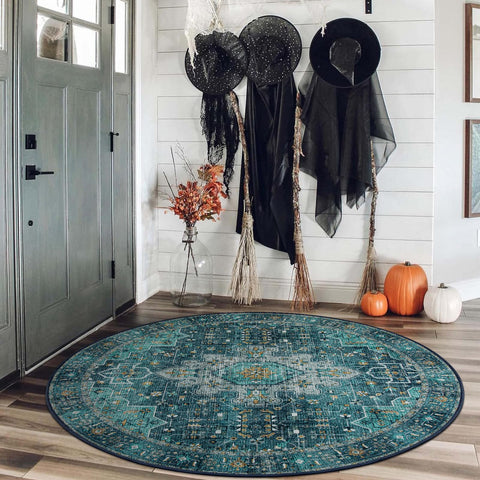 Moynesa teal round rug with non-slip back for secure placement.