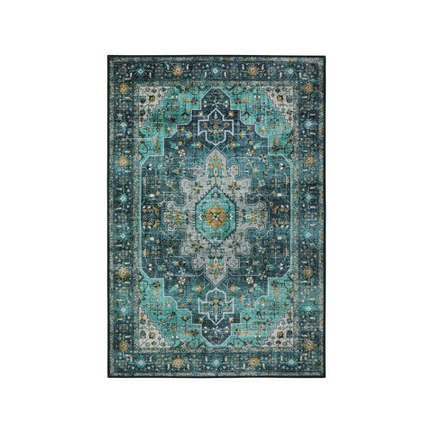 Moynesa Stain-Resistant Teal Entryway Rug stays neat against daily traffic.