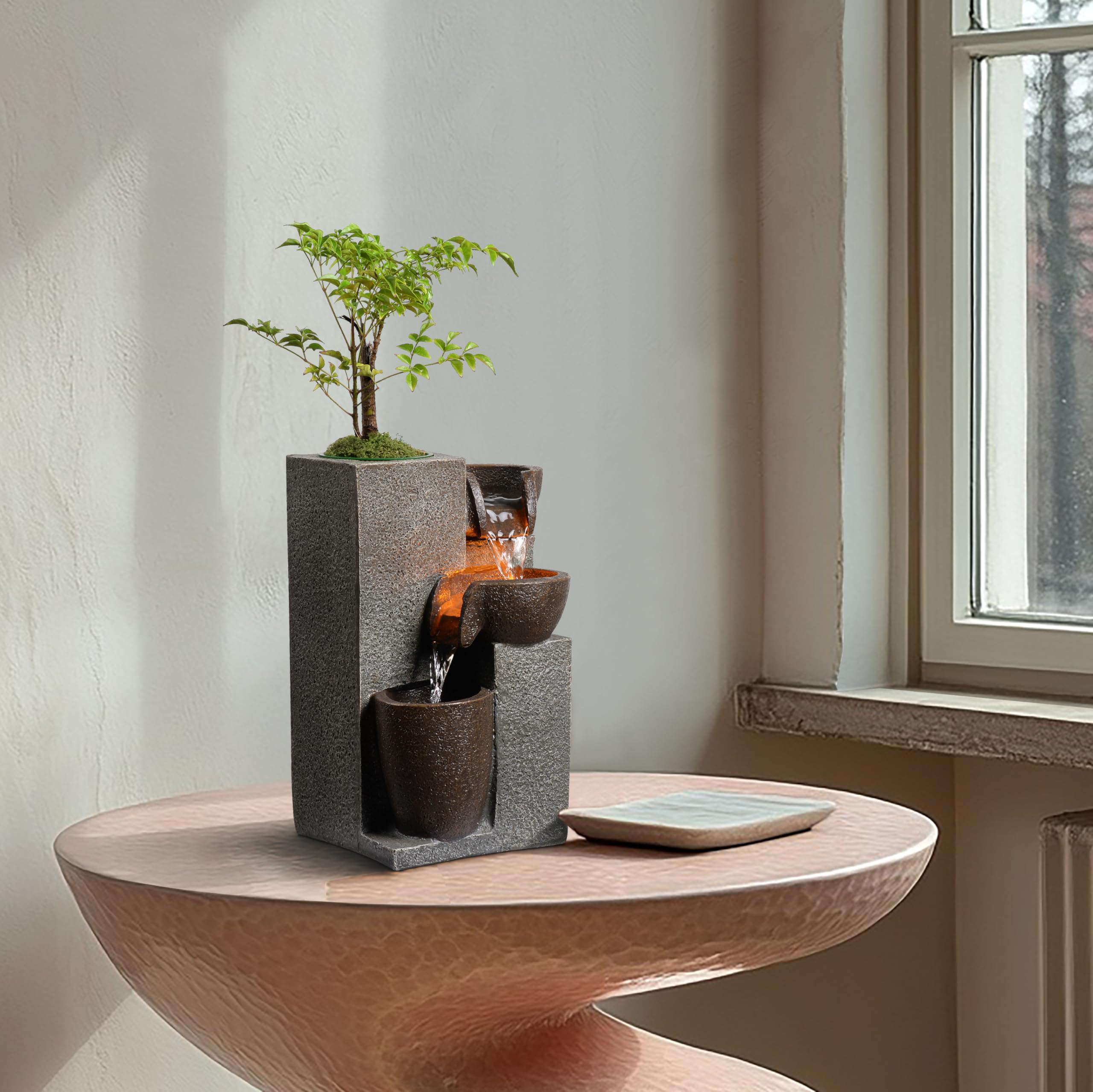 MSEONWXI resin fountain with plant pot blends greenery with motion for refreshed space.