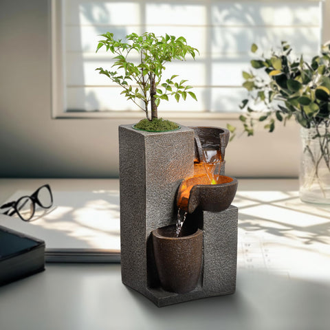 MSEONWXI resin tabletop fountain with cascading waterfall and warm LEDs for desk ambiance.