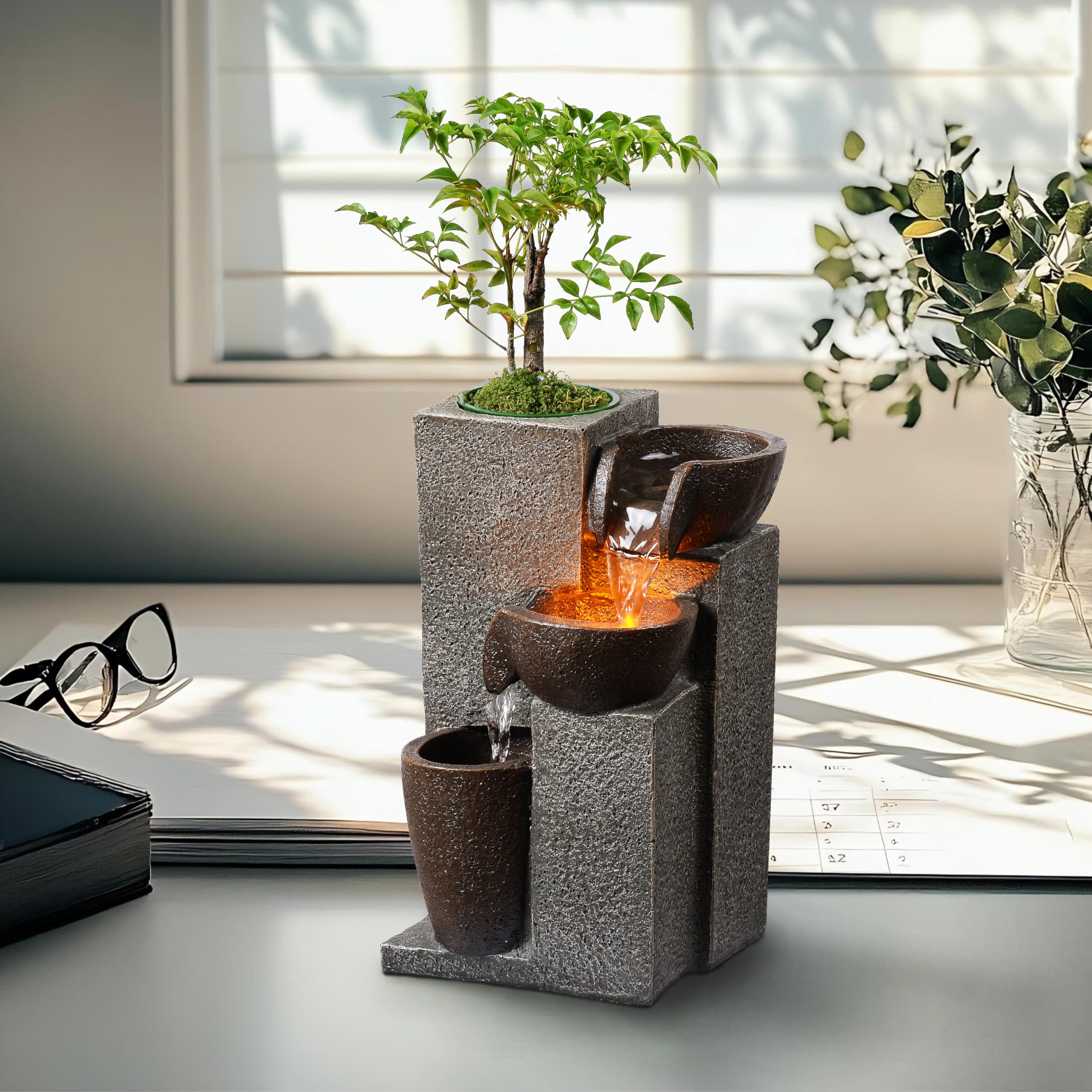 MSEONWXI resin tabletop fountain showcases integrated plant pot for greenery and soothing sounds.