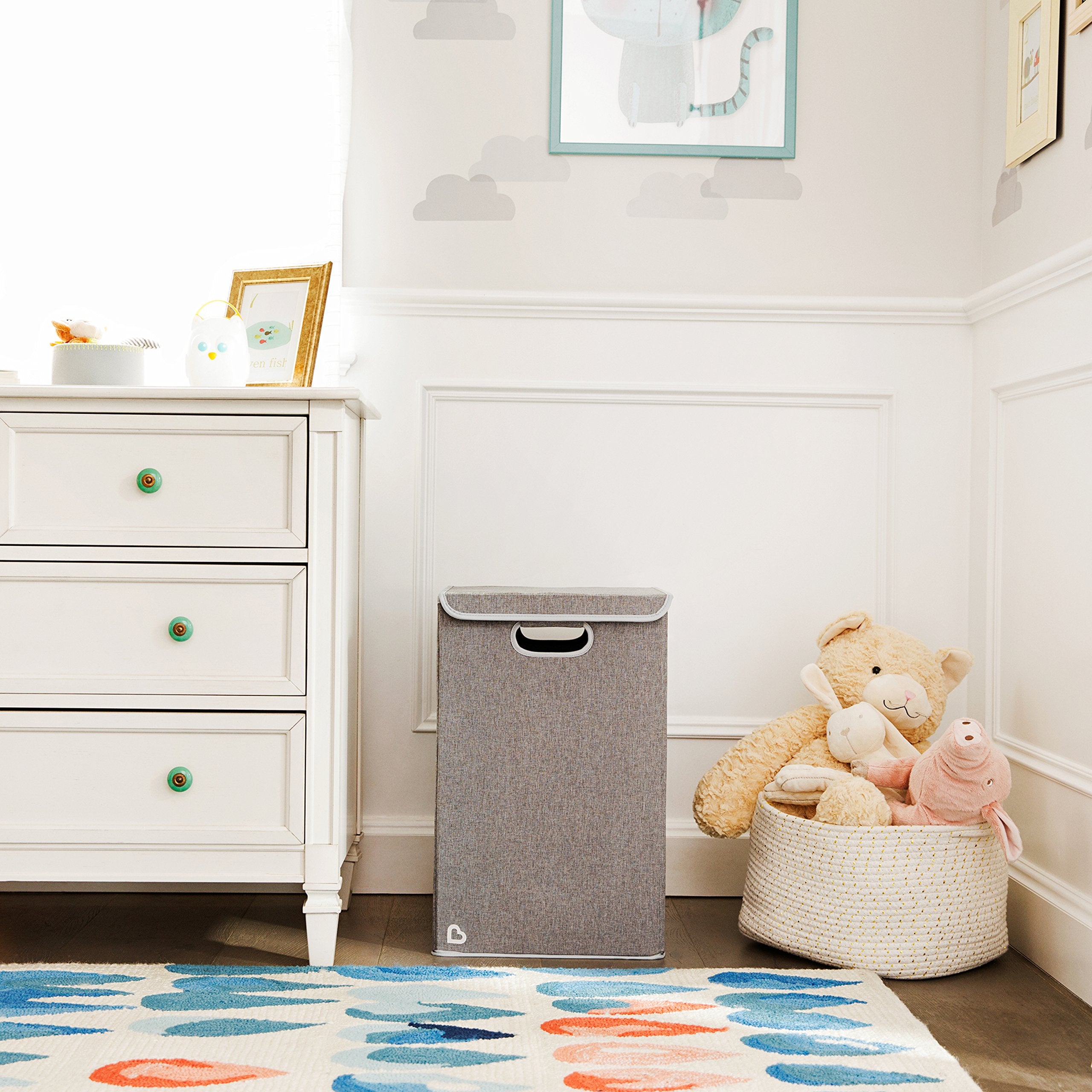 Munchkin Laundry Hamper laminated interior wipes down easily for quick cleanup.
