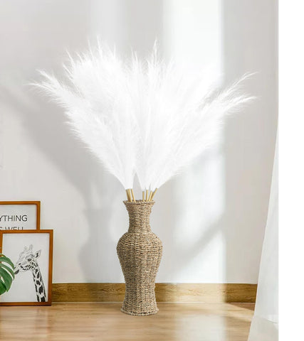 MUUNC white artificial pampas grass decor in a floor vase creates boho chic flair.