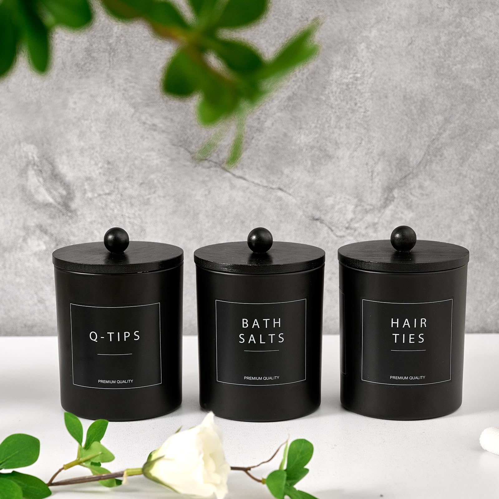 Muveka bamboo tray display complements black glass canisters on the counter.