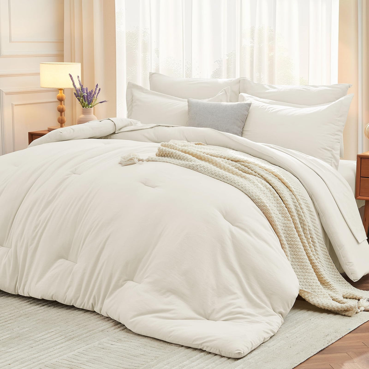 MUXHOMO 7-piece queen comforter set in ivory on a neatly made bed for all-season comfort