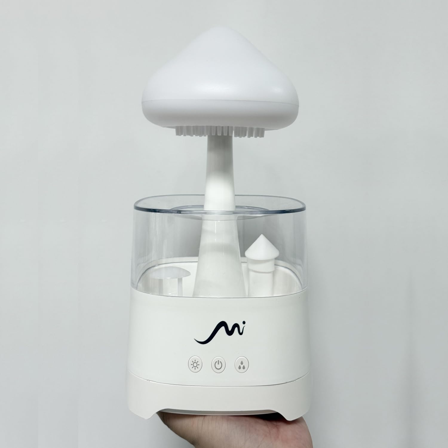 MYSTIQ Rain Cloud humidifier modern cloud design enhances bedroom décor.