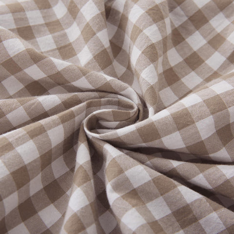 Mywinlle taupe plaid ruffle cover styled on a sofa for inviting decor