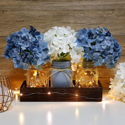 Nagobi distressed glass jars glow softly with vintage style lighting