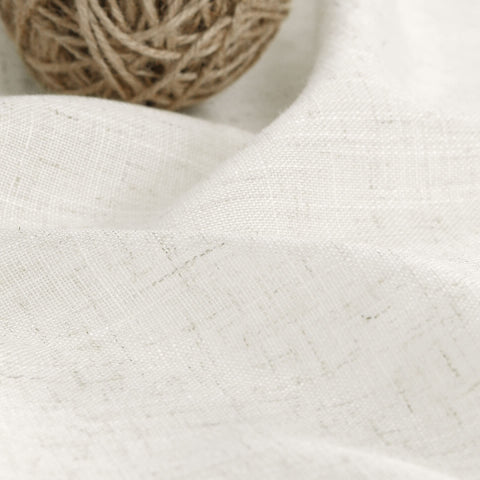 Nanspring ivory curtains in a farmhouse room achieve tranquil decor.