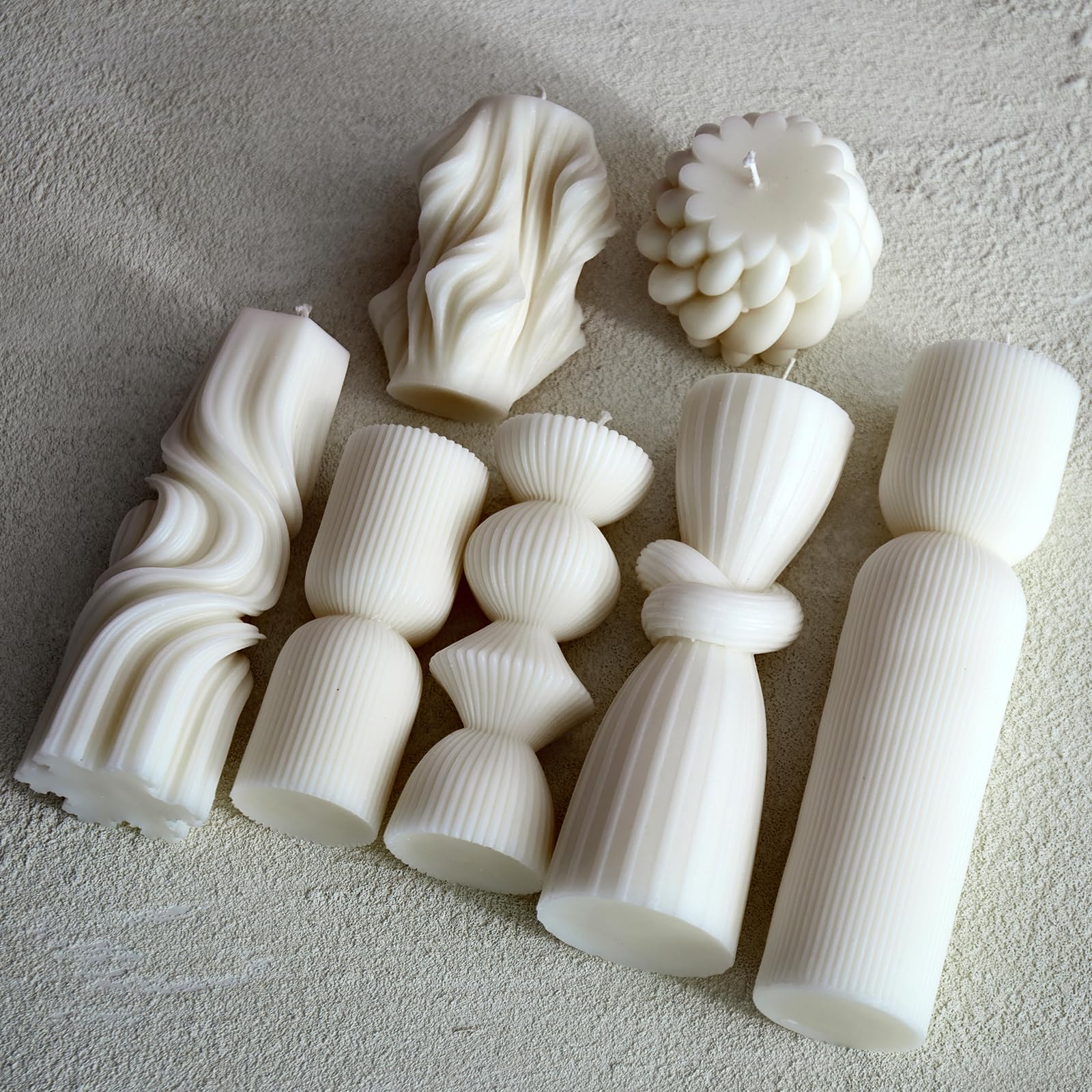 NATCENSE close-up of handmade ribbed texture on pillar candles.