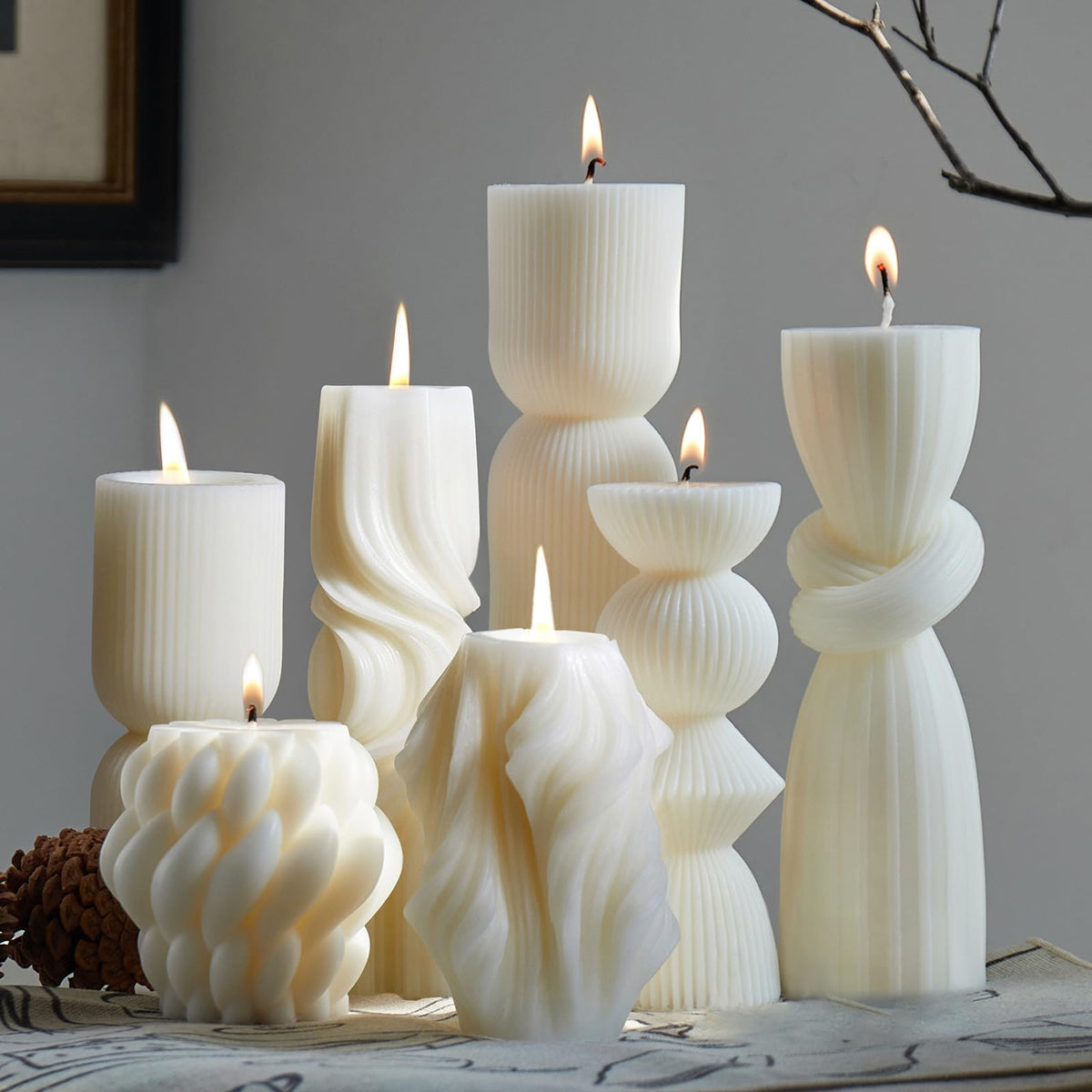 NATCENSE 7-pack pillar candles in white ribbed finish for elegant home ambiance.