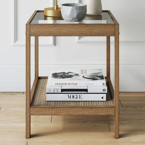 Hayes open shelf provides breathable storage for books and remotes.