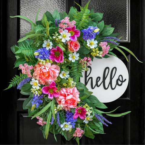 NaturaWre 24-inch Spring Wreath with wooden welcome sign enhances curb appeal.