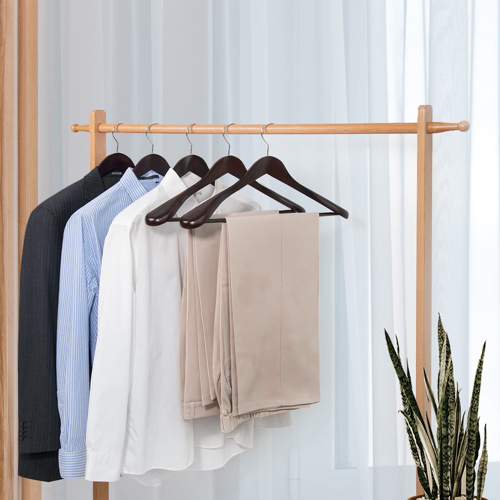 Nature Smile hanger in closet keeps outfits neat and wrinkle-free.