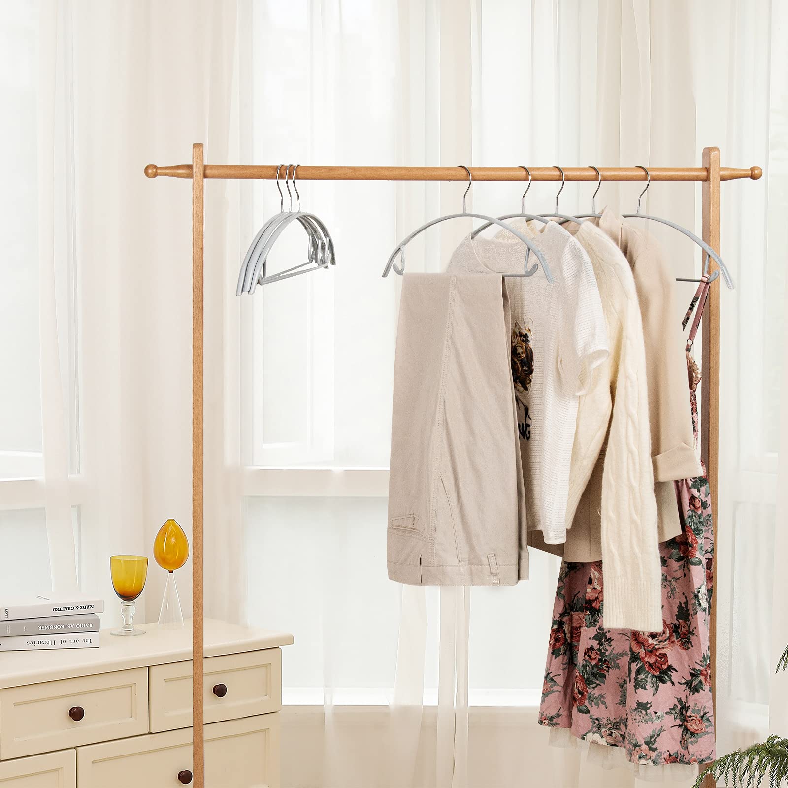 Nature Smile multi-function hanger holds coats, sweaters, scarves, and belts neatly.