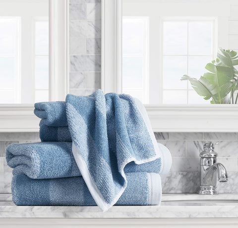 Nautica Oak Lake Blue hand towel folded, showcasing absorbent texture.