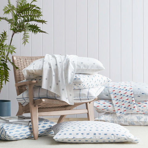 Nautica whale stripe blue pillowcase closeup highlighting soft cotton weave for cooling sleep.