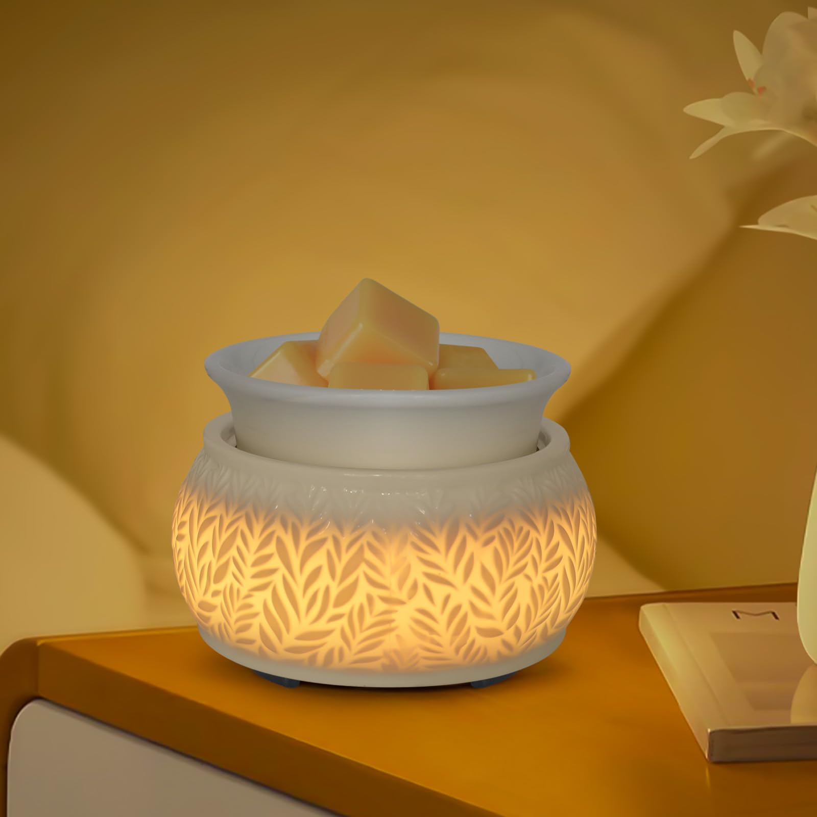 Nawaza white ceramic wax melt warmer for peaceful room fragrance.