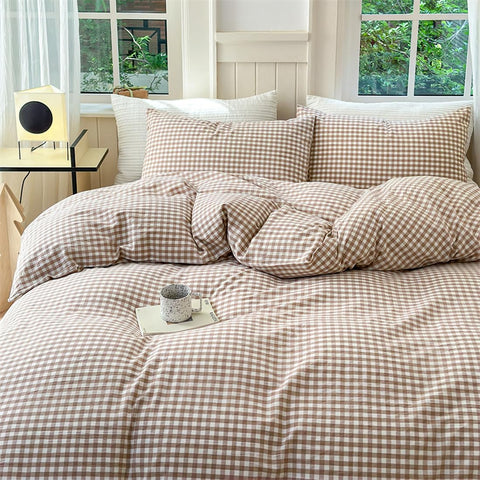 Nayoroom brown gingham duvet cover folded neatly for compact storage.