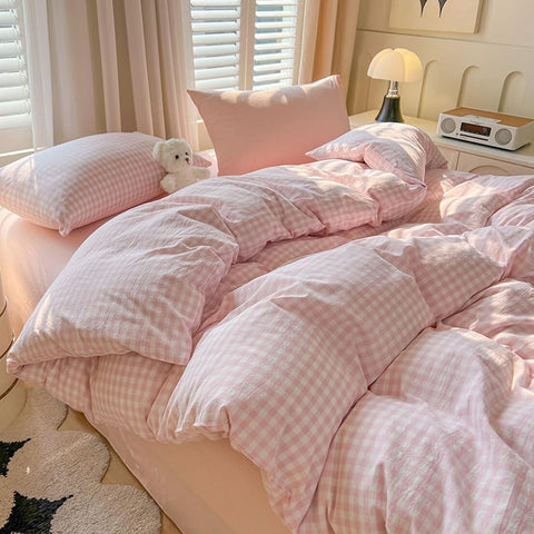 Nayoroom pink gingham pillow shams complete the 3-piece set.