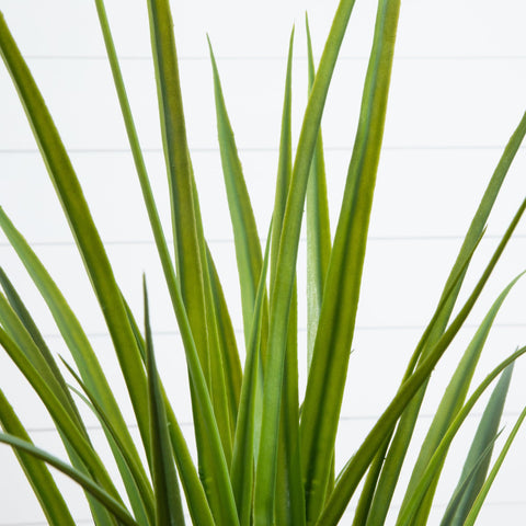 Nearly Natural 4ft artificial grass plant closeup leaves show lifelike texture.