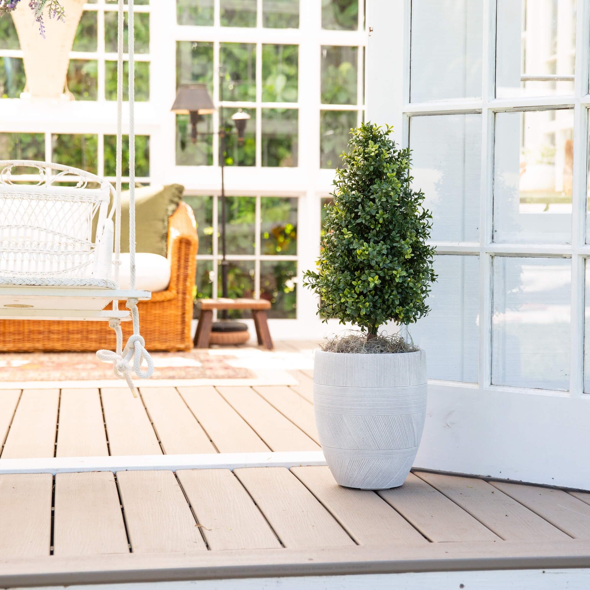 Nearly Natural boxwood ideal for entryways adding welcoming greenery year-round.