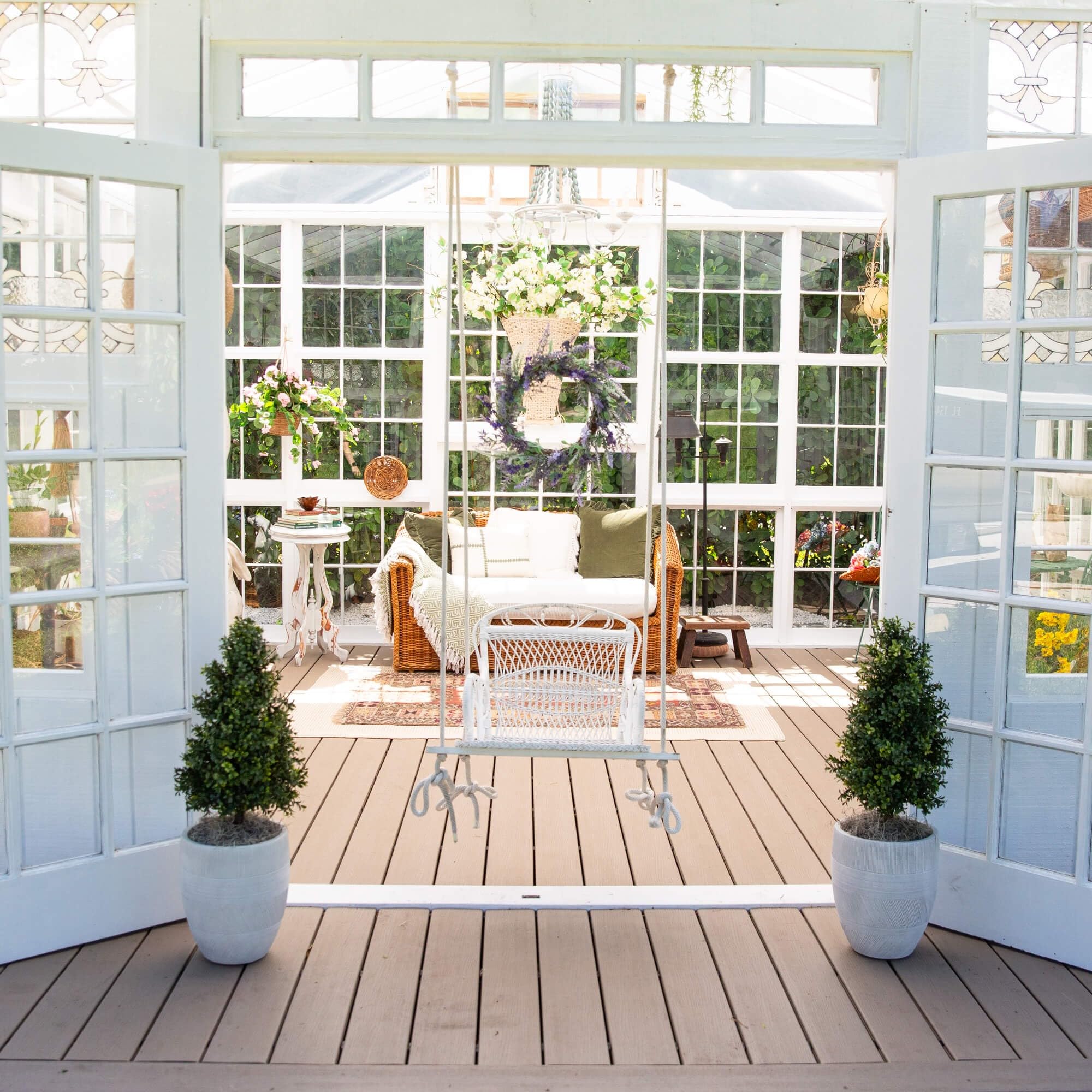 Nearly Natural boxwood patio decor creates instant outdoor ambiance.