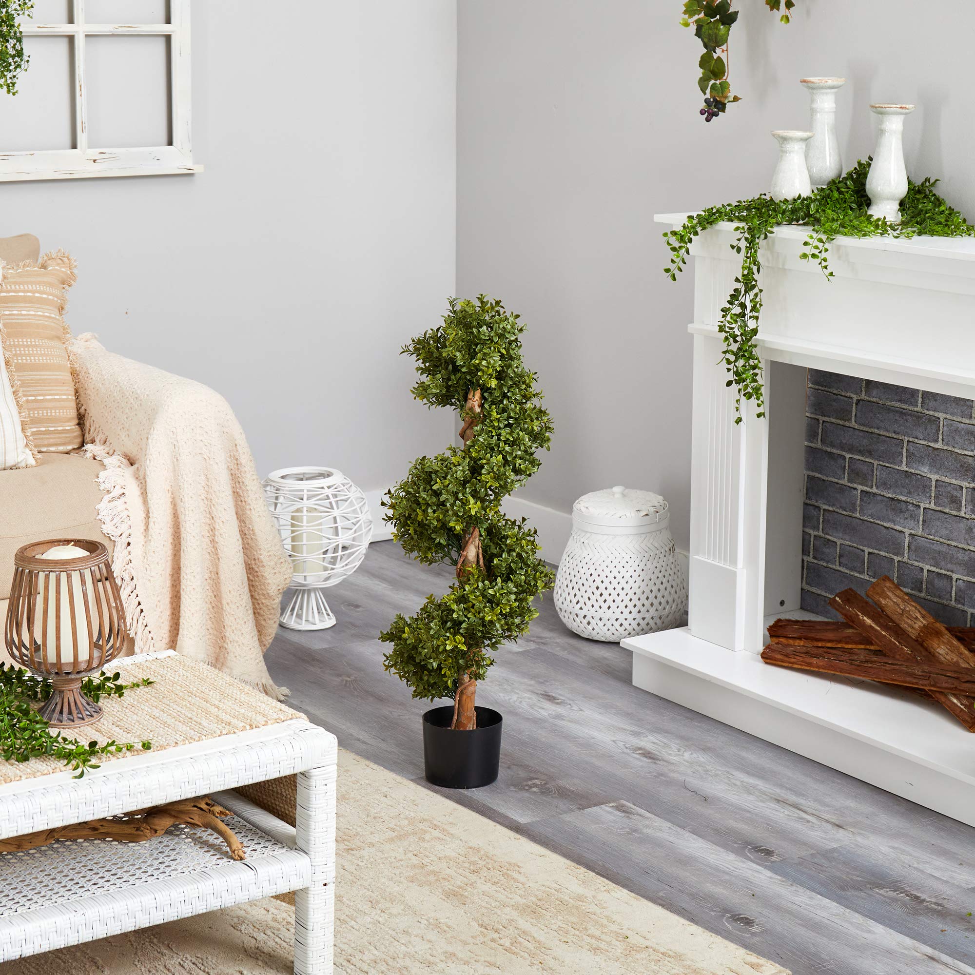 Nearly Natural boxwood topiary arranged in multiples for cohesive entryway styling.