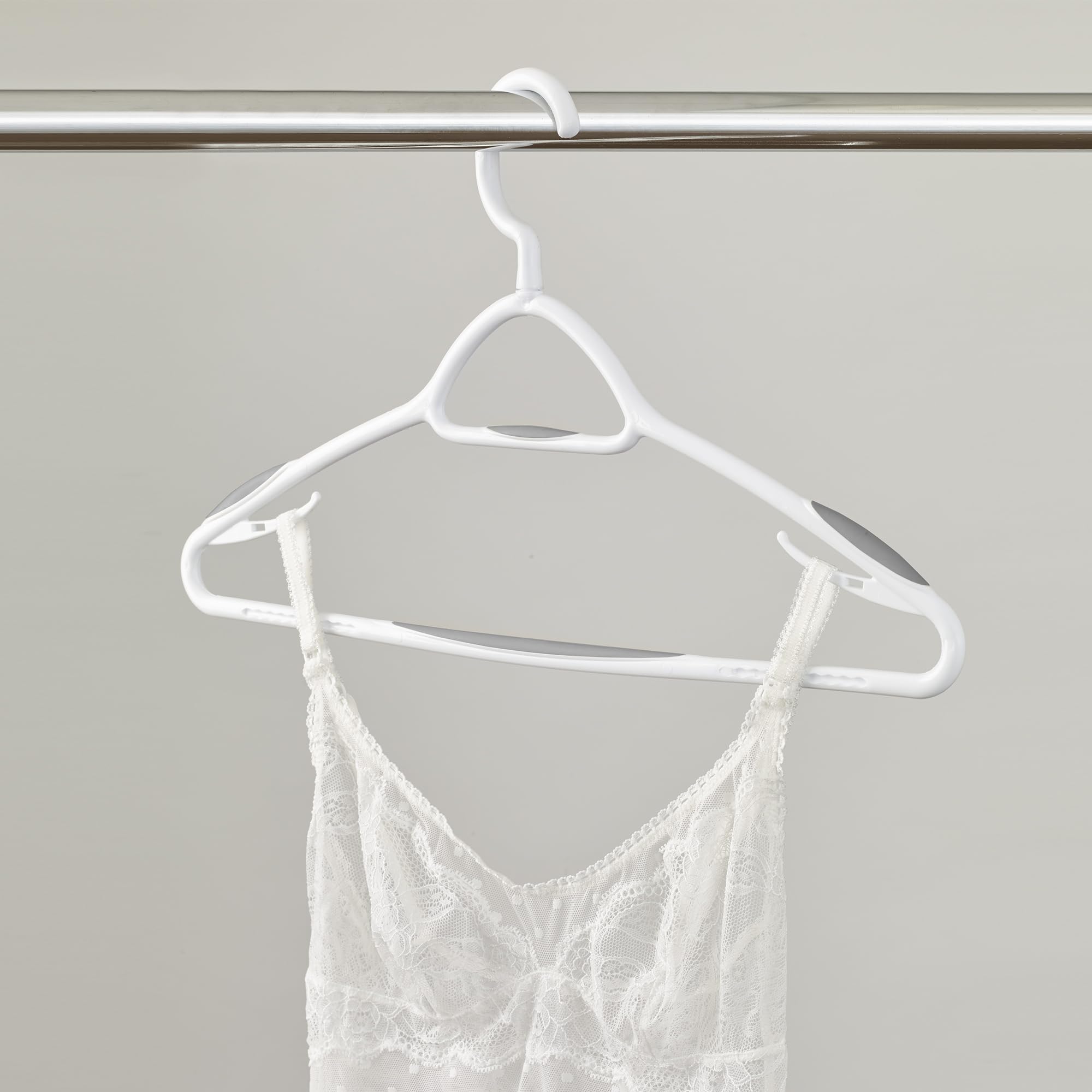 Neatfreak deluxe non-slip hangers feature space-saving hooks for compact storage.
