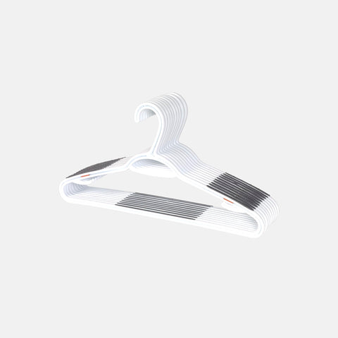 Neatfreak white plastic hangers create a clean, uniform closet look.