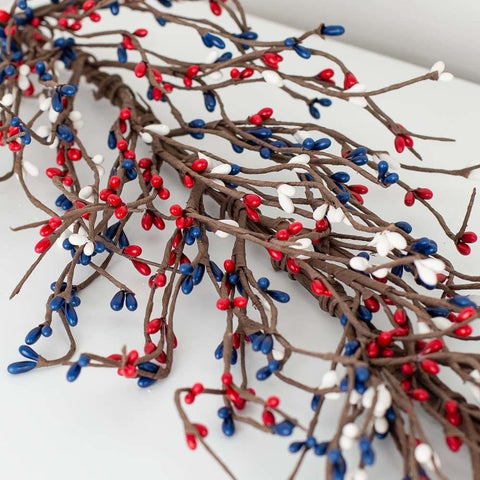 NeoL'artes 60in Patriotic Pip Berry Garland draped on a mantel for festive Americana charm.