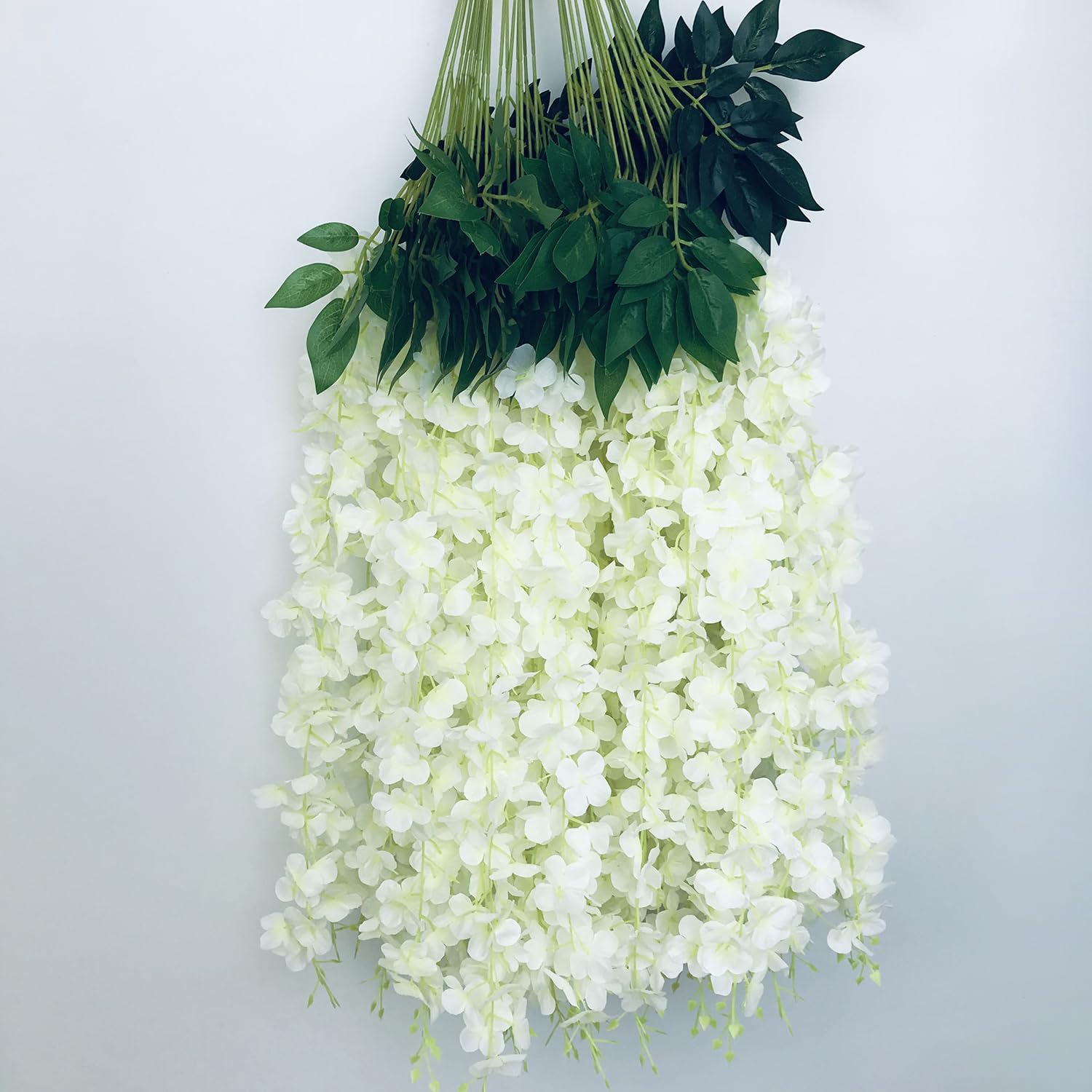 NEOONES wisteria vines arch display creating a romantic focal point for ceremonies