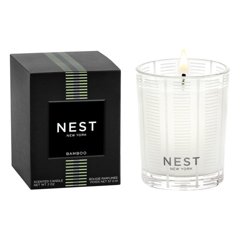 NEST New York Bamboo votive in frosted glass vessel enhances ambience.