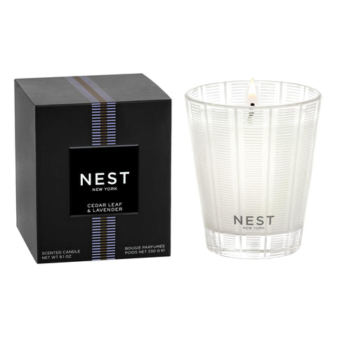 Nest New York cedar-leaf-lavender candle in glass vessel for serene ambience.