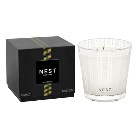 Nest New York Grapefruit 3-Wick Candle in glass container creating elegant room ambiance