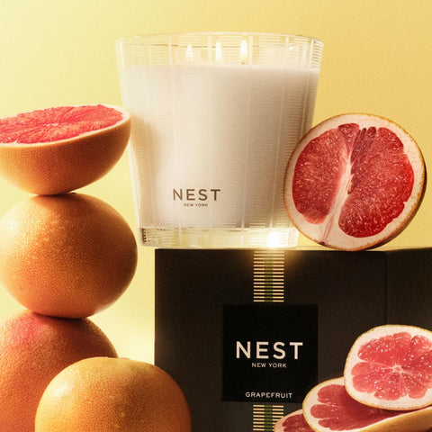 Grapefruit candle in ambient lighting setup, enhancing the mood
