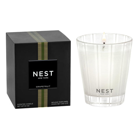 Nest New York Grapefruit Classic Candle in glass vessel enhances ambiance.