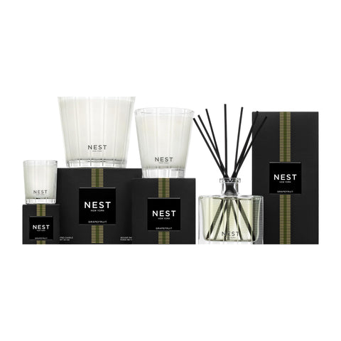 Room scene with Nest New York Grapefruit candle highlighting bright citrus vibes