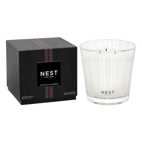 Nest New York Moroccan Amber 3-Wick Candle in a frosted striped glass jar for elegant decor.