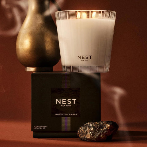 Lit Nest New York Moroccan Amber candle creates a warm living room ambiance.