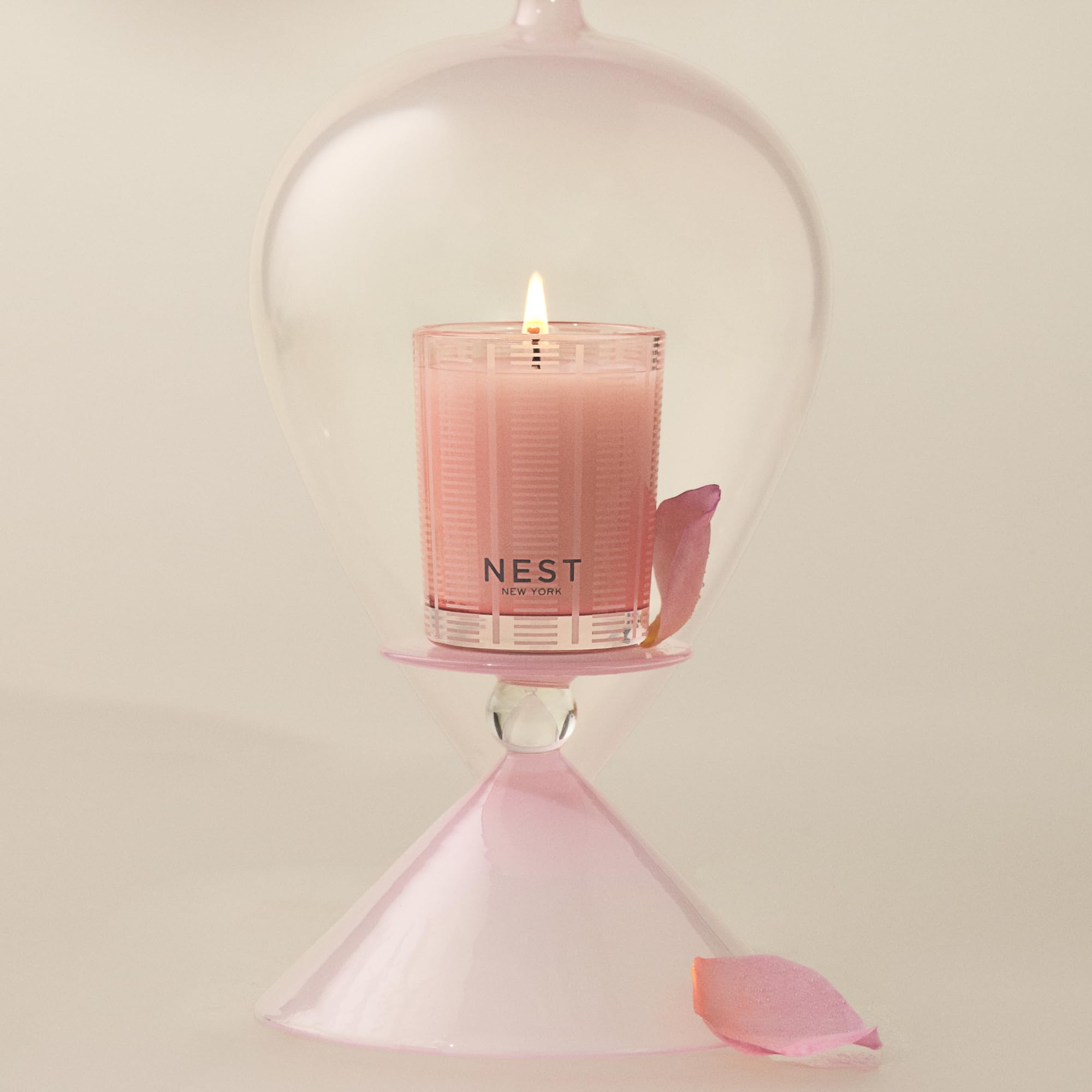 Nest New York pink-tinted wax candle highlighting premium burn for evenings.