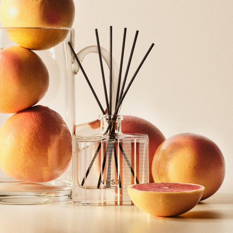 Grapefruit packaging for NEST New York Reed Diffuser emphasizes care and quality